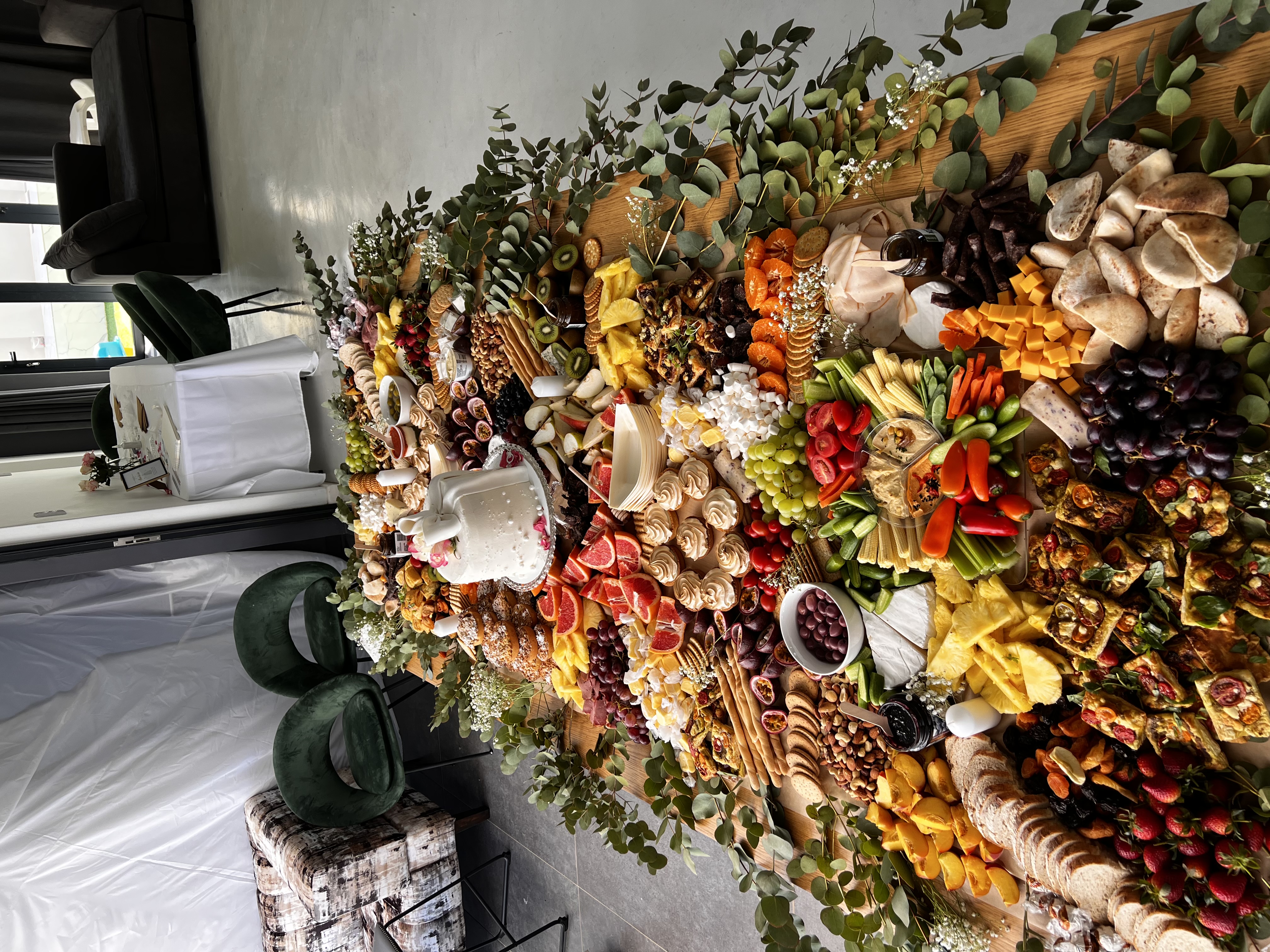A long abundant grazing table in the studio